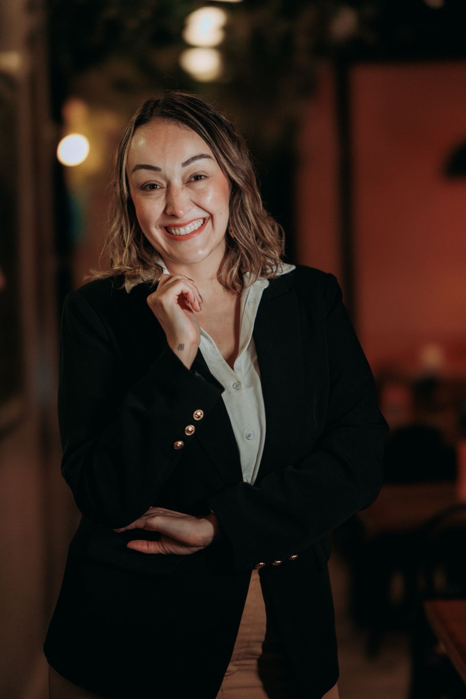 A hospitality professional in a hotel hallway, representative of the General Manager role.